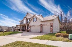 white painted house beside green grass lawn When To Hire A Property Management Company For Your Real Estate Investment?