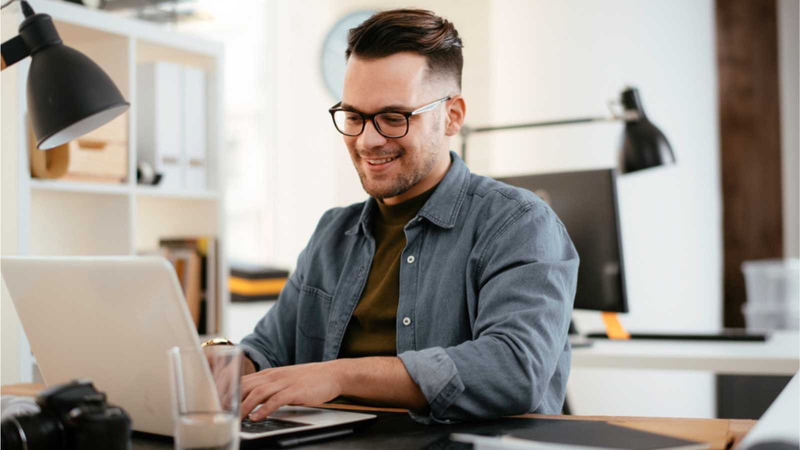 Man smiling at work shutterstock MSN 10 Quotes and Pieces of Advice That Scream Toxic Positivity